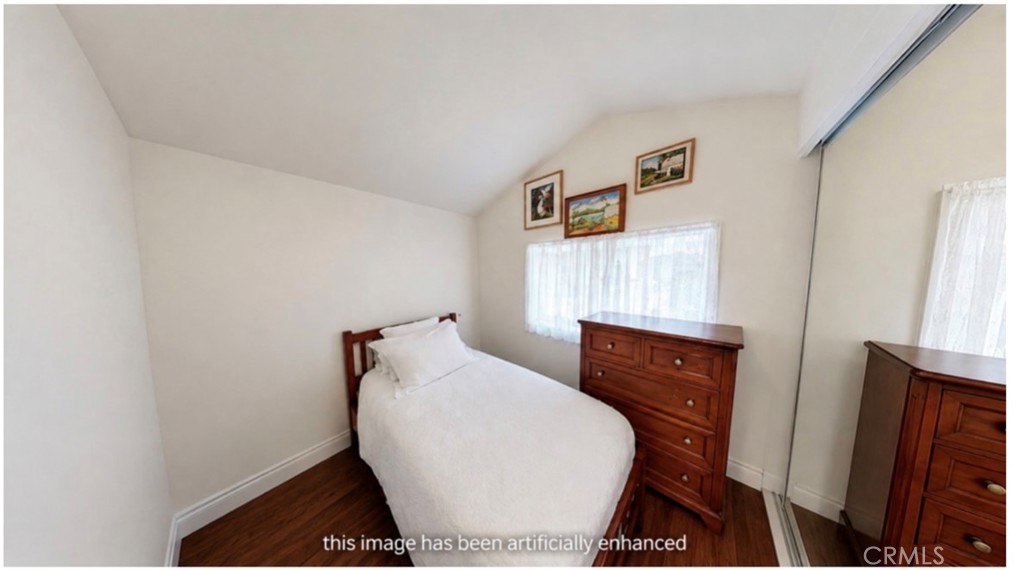 43 Riversea Road Seal Beach, CA 90740 - Photo 7 of 7 a room with wooden floor and furniture