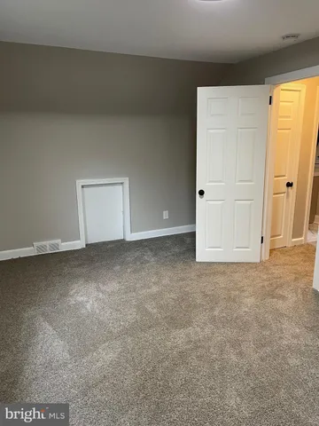 a bath tub sitting next to a white sink