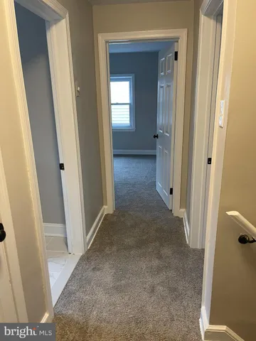 a bathroom with a toilet a sink and a mirror