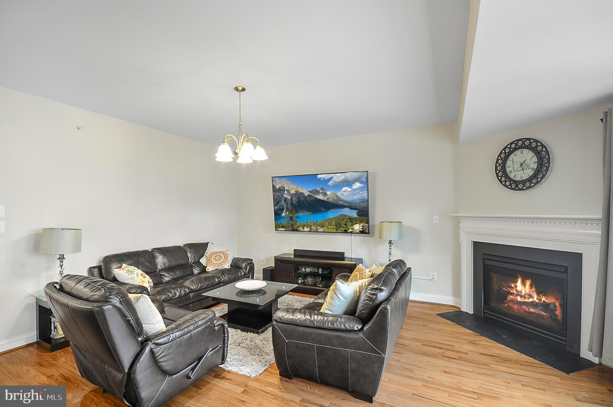 2405 Cindy Lane Warrington, PA 18976 - Photo 13 of 44 a living room with furniture a fireplace and a chandelier