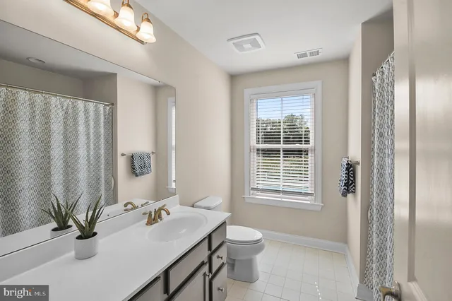 a bathroom with a sink toilet and tub