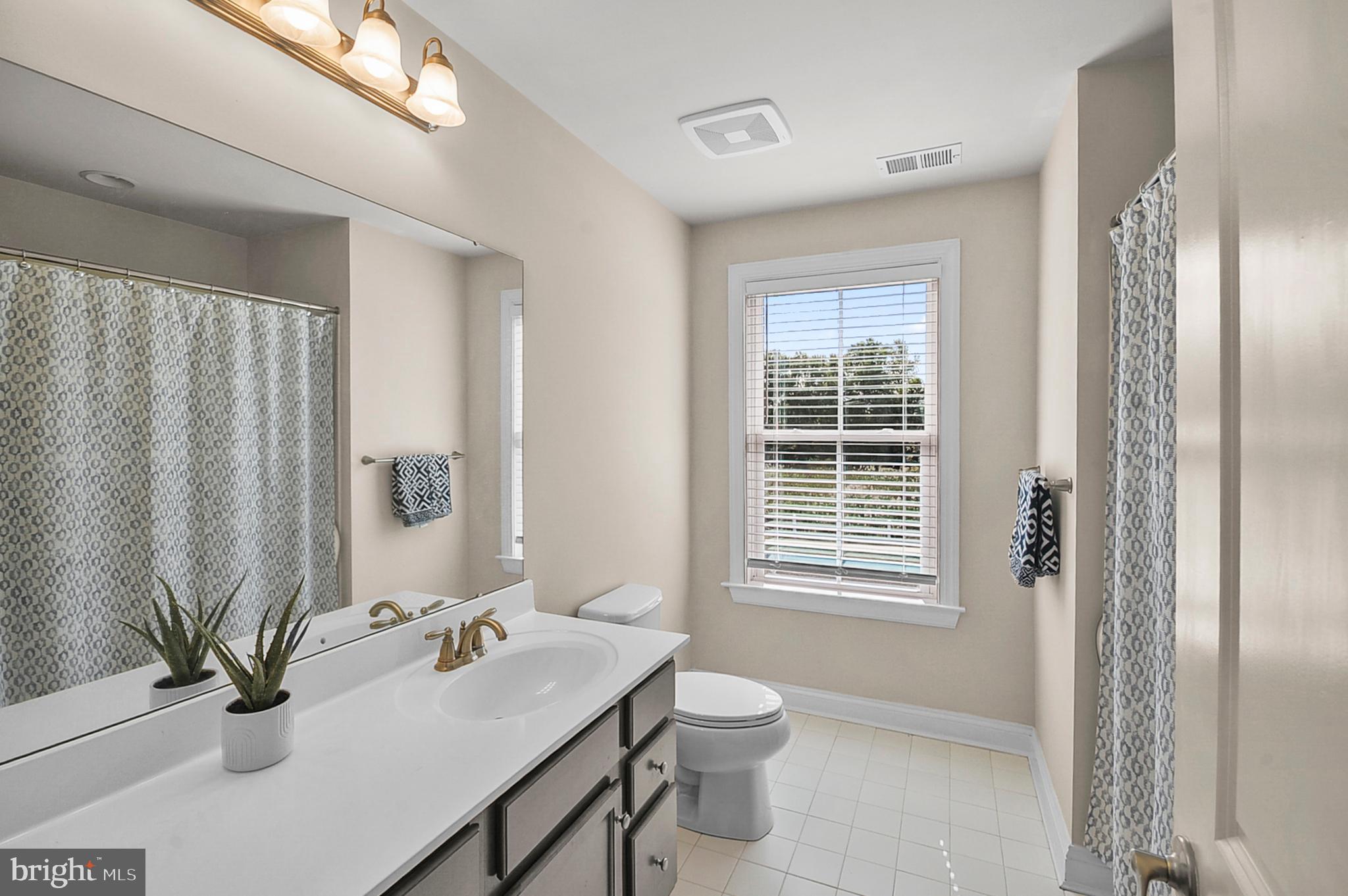 2405 Cindy Lane Warrington, PA 18976 - Photo 25 of 44 a bathroom with a sink toilet and tub