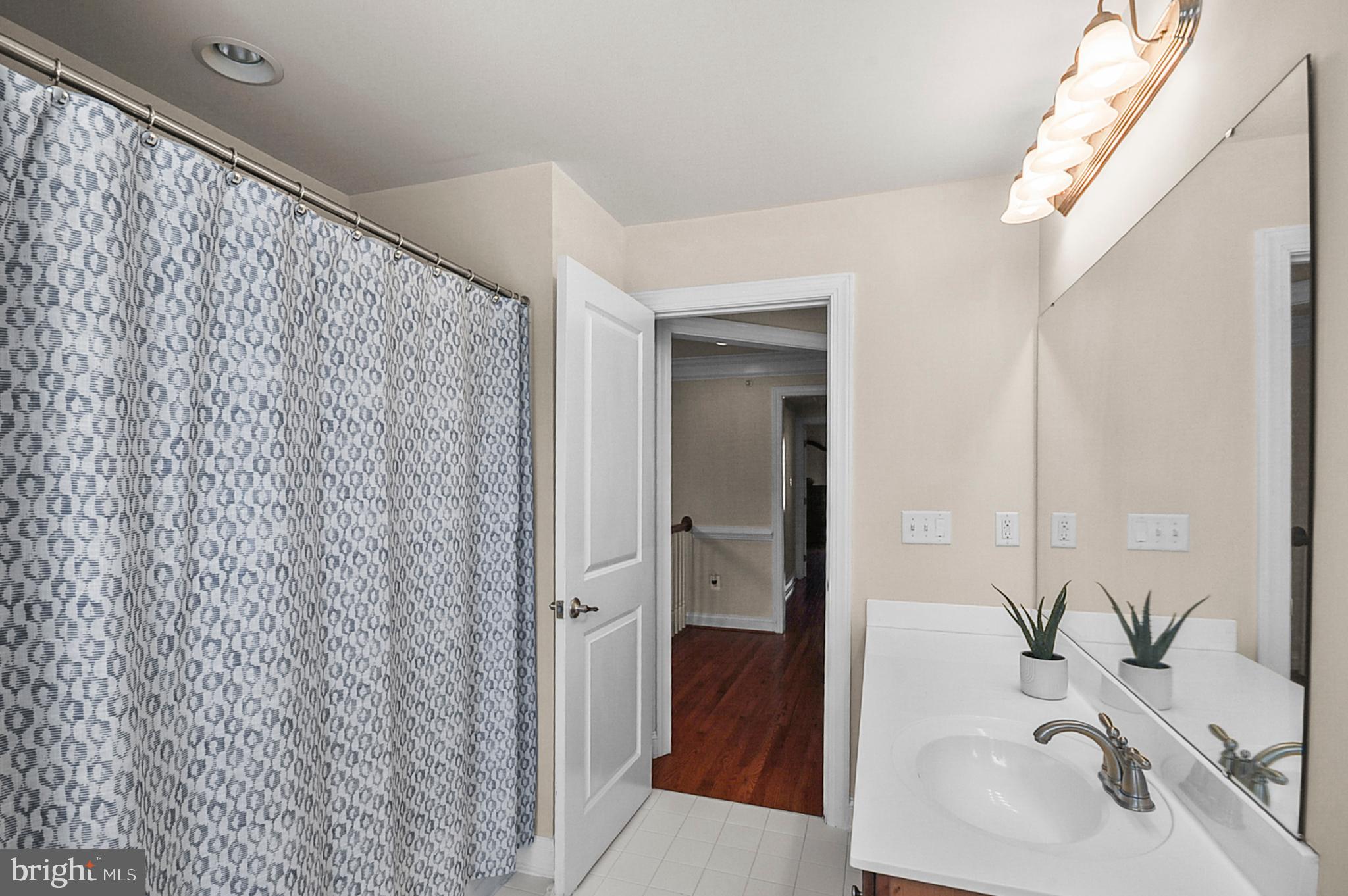 2405 Cindy Lane Warrington, PA 18976 - Photo 26 of 44 a bathroom with a sink and a mirror