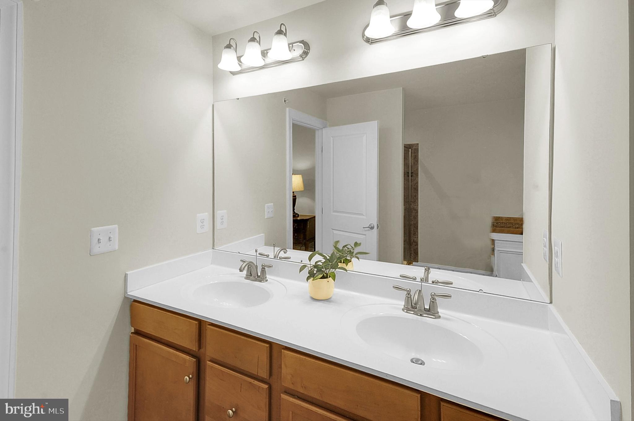 2405 Cindy Lane Warrington, PA 18976 - Photo 34 of 44 a bathroom with a sink double vanity and a mirror