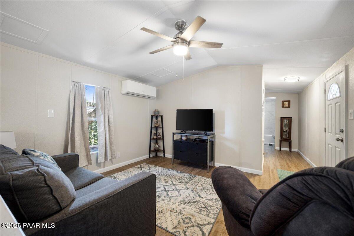 689 Whipple Street, Unit 8 Prescott, AZ 86301 - Photo 4 of 17 a living room with furniture and a flat screen tv