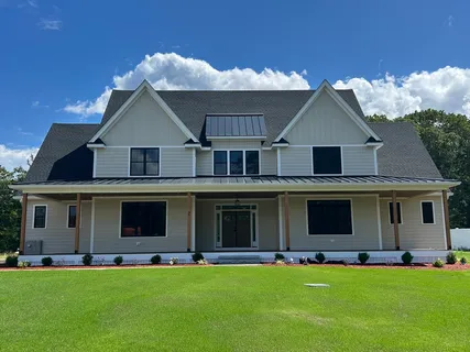 a front view of the house with a yard