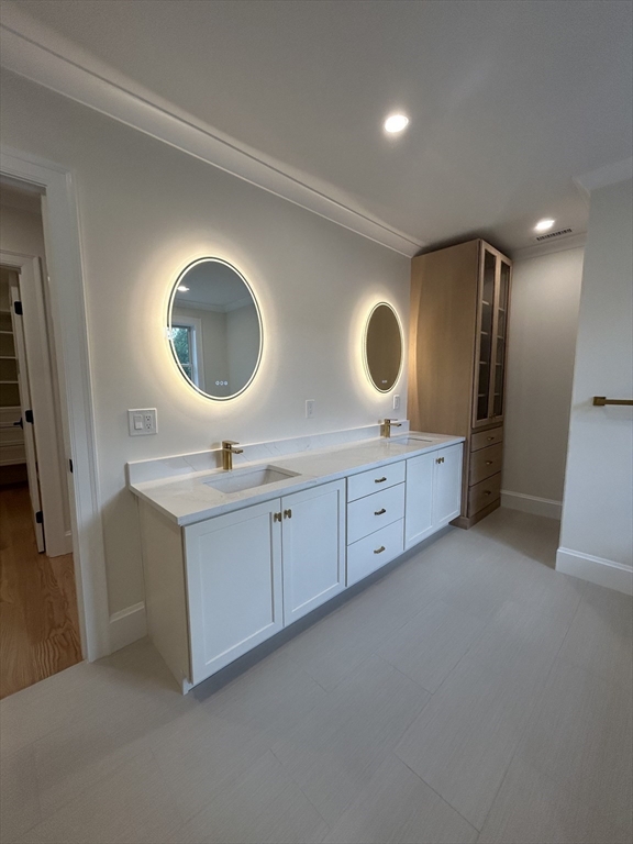 12 Cranberry Mdw Way North Reading, MA 01864 - Photo 20 of 35 a bathroom with a double vanity sink and a mirror