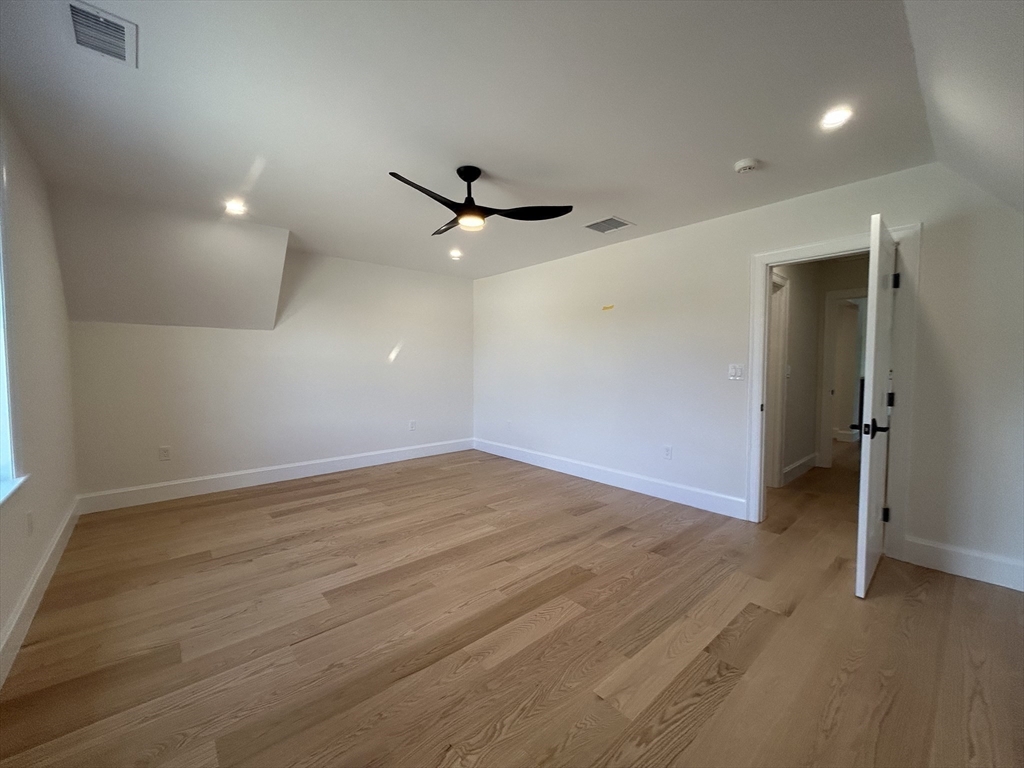 12 Cranberry Mdw Way North Reading, MA 01864 - Photo 21 of 35 an empty room with a ceiling fan and a window