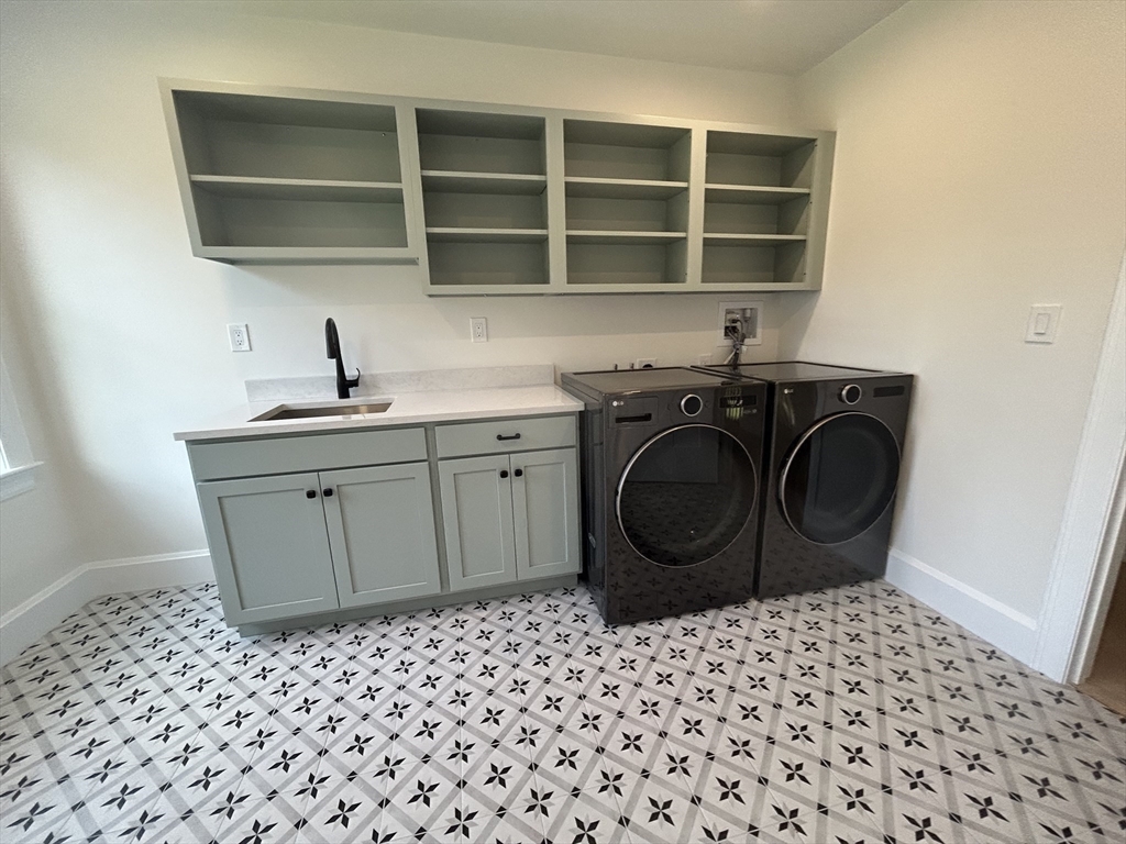 12 Cranberry Mdw Way North Reading, MA 01864 - Photo 23 of 35 a kitchen with a sink a stove and a wooden cabinets