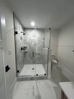 a bathroom with a sink vanity mirror and toilet