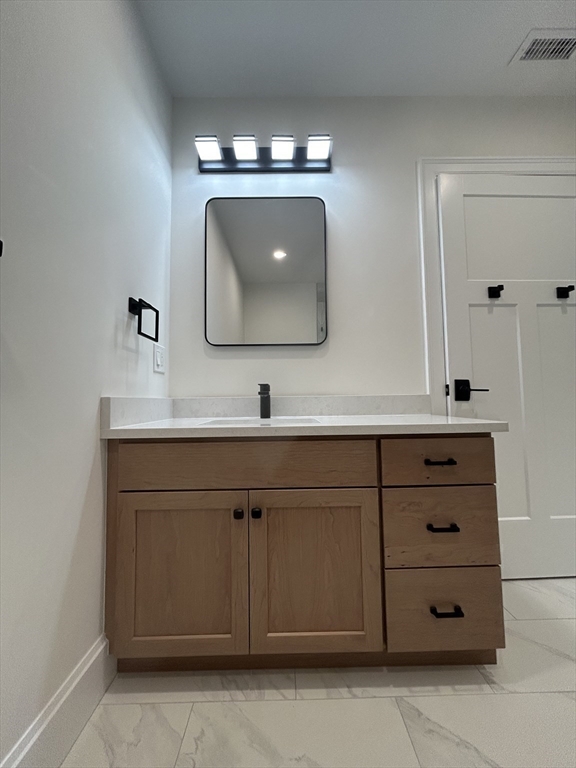12 Cranberry Mdw Way North Reading, MA 01864 - Photo 25 of 35 a bathroom with a sink vanity and mirror