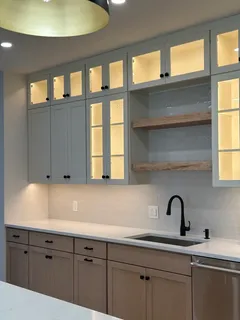 a kitchen with a sink and cabinets