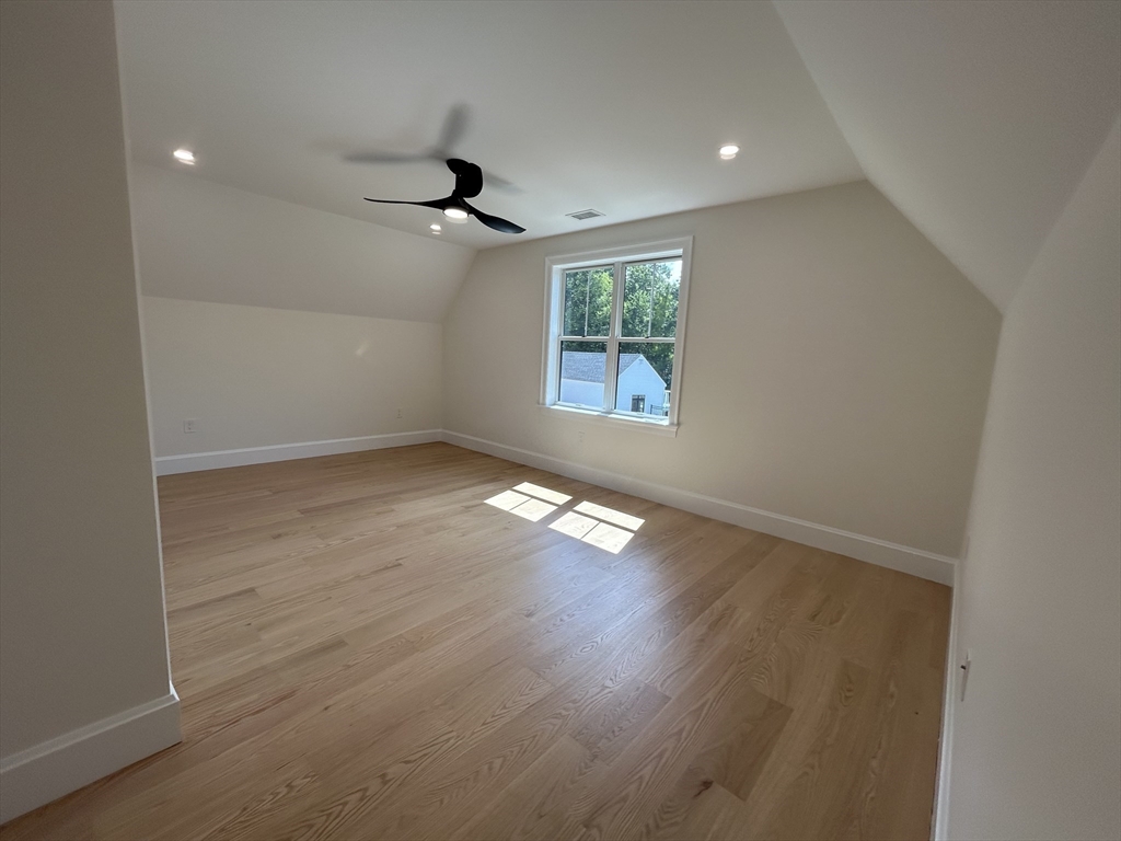12 Cranberry Mdw Way North Reading, MA 01864 - Photo 30 of 35 an empty room with wooden floor and windows