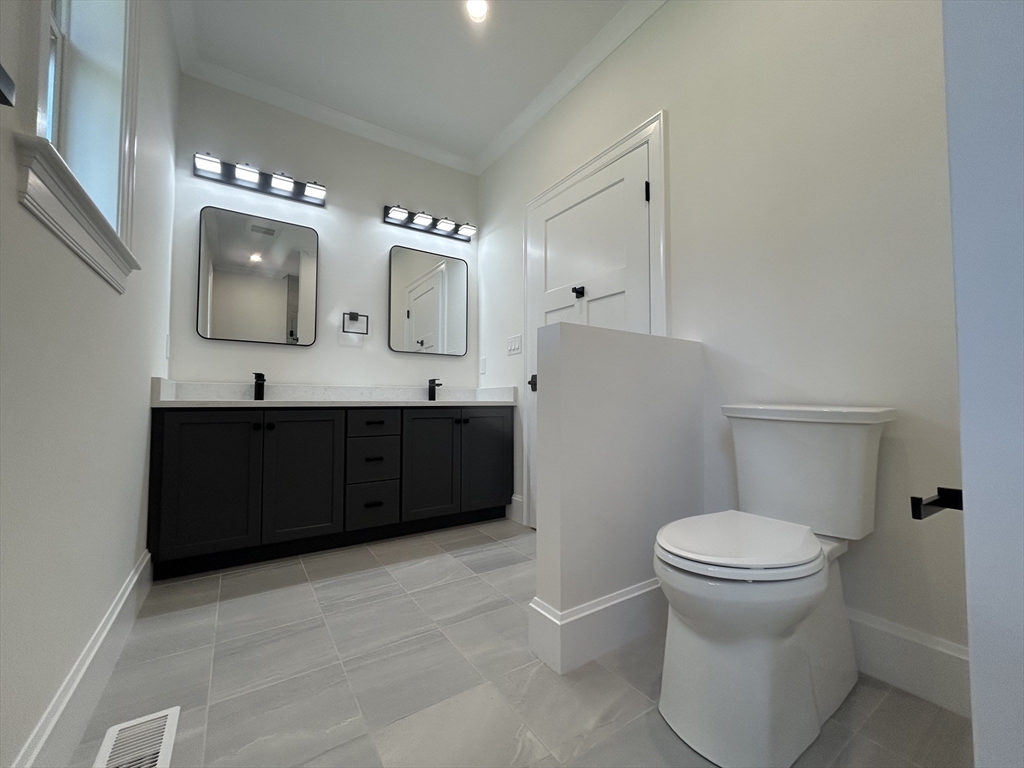 12 Cranberry Mdw Way North Reading, MA 01864 - Photo 31 of 35 a bathroom with a sink vanity mirror and toilet