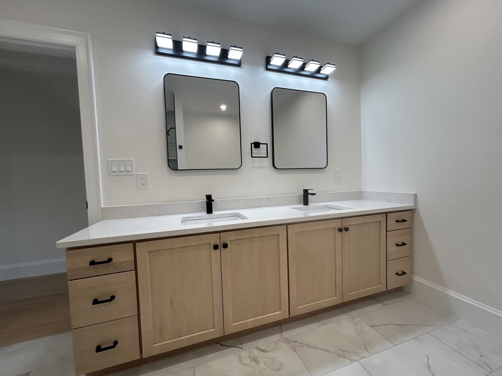 12 Cranberry Mdw Way North Reading, MA 01864 - Photo 33 of 35 a bathroom with a double vanity sink and a mirror