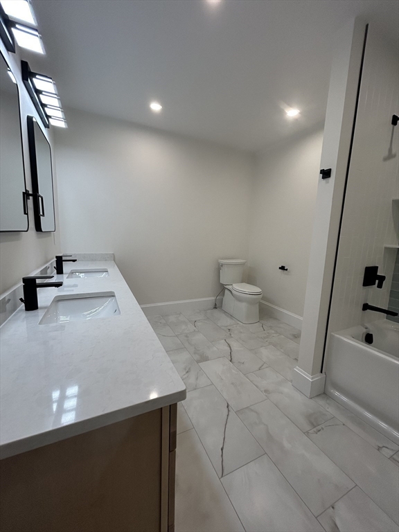 12 Cranberry Mdw Way North Reading, MA 01864 - Photo 34 of 35 a bathroom with a sink a toilet and shower