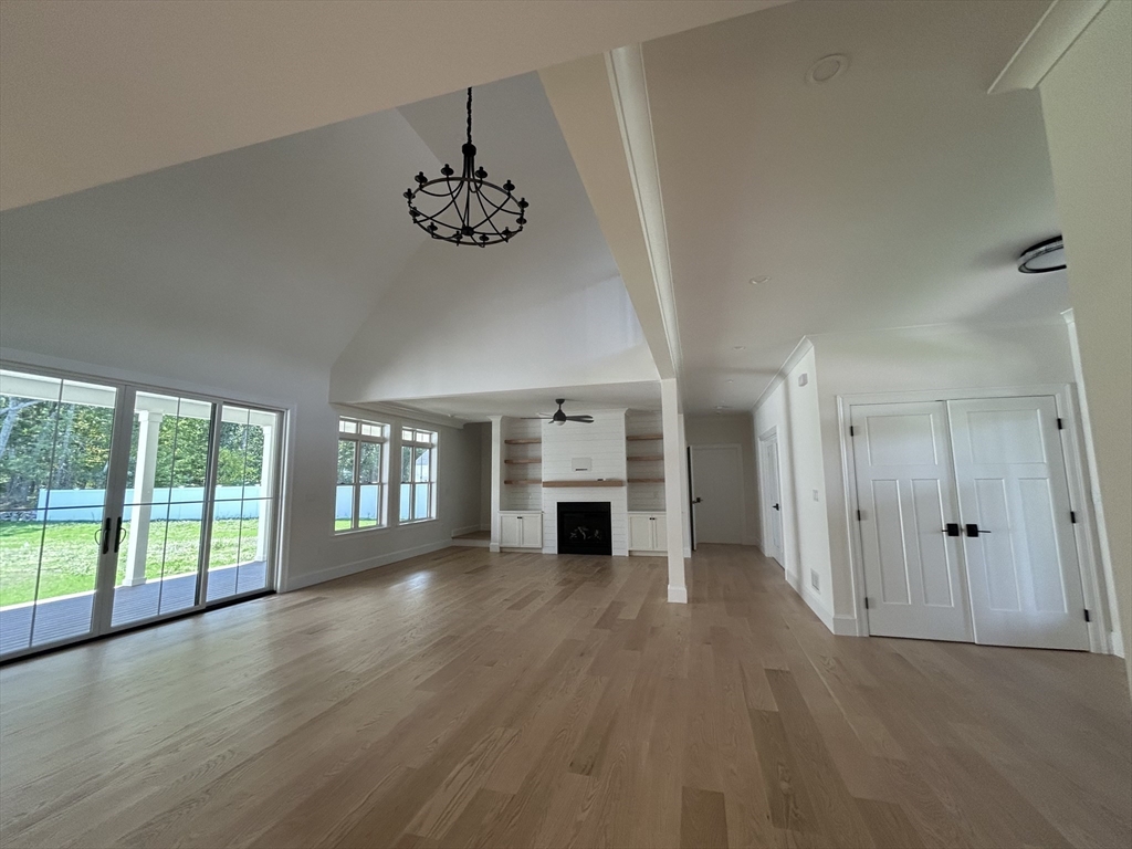 12 Cranberry Mdw Way North Reading, MA 01864 - Photo 6 of 35 an empty room with windows and fireplace