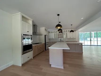 a kitchen with a sink and cabinets