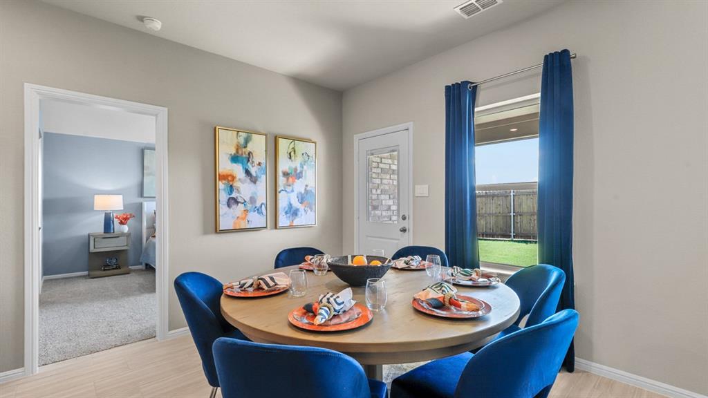 557 Marsh Street Cleburne, TX 76033 - Photo 11 of 40 a view of a dining room with furniture window and outside view