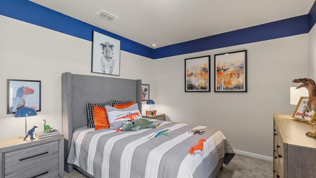 557 Marsh Street Cleburne, TX 76033 - Photo 29 of 40 a bedroom with a bed and a desk