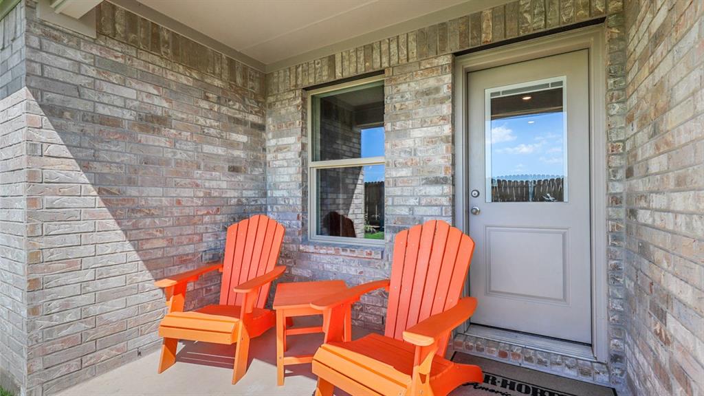 557 Marsh Street Cleburne, TX 76033 - Photo 39 of 40 a backyard of a house with barbeque oven table and chairs