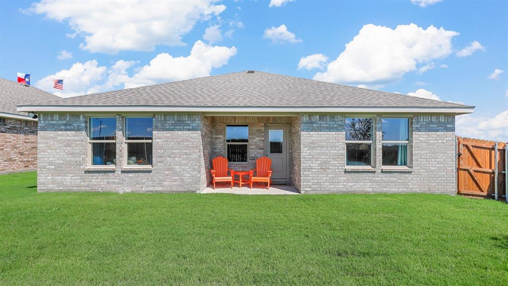 557 Marsh Street Cleburne, TX 76033 - Photo 34 of 40 a front view of a house with a yard and entertaining space