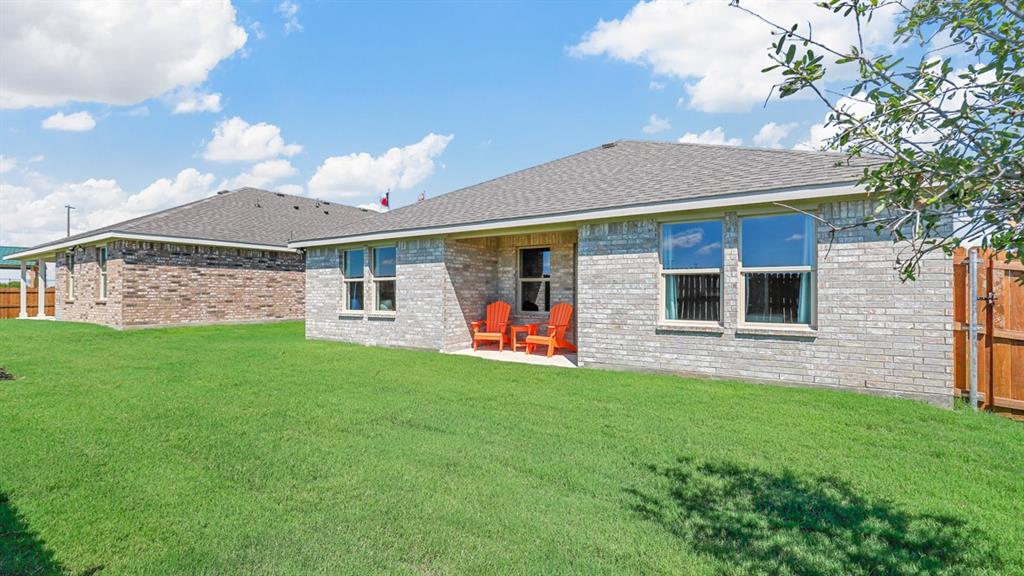 557 Marsh Street Cleburne, TX 76033 - Photo 35 of 40 a front view of a house with a yard and garage