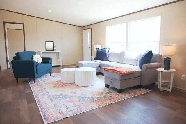 a living room with furniture and a window