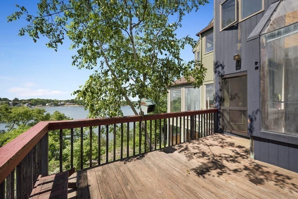 50 Pinecliff Drive Marblehead, MA 01945 - Photo 18 of 41 a view of a wooden street from a balcony