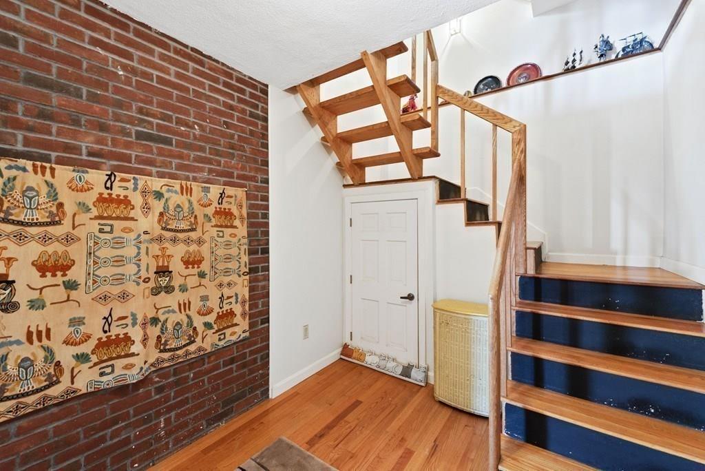 50 Pinecliff Drive Marblehead, MA 01945 - Photo 19 of 41 a view of a hallway with wooden floor and staircase