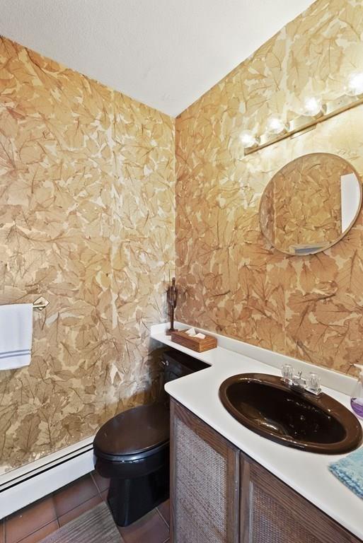 50 Pinecliff Drive Marblehead, MA 01945 - Photo 8 of 41 a sink and a stove with wooden floor