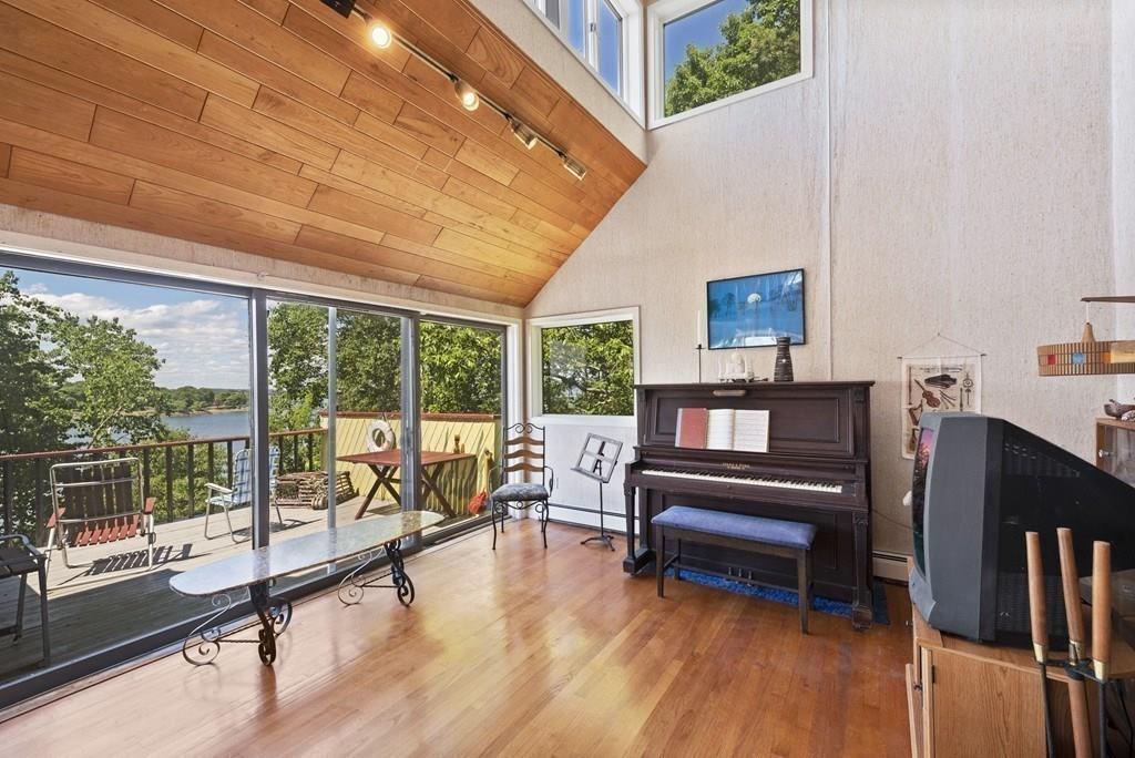 50 Pinecliff Drive Marblehead, MA 01945 - Photo 9 of 41 a living room with furniture and a floor to ceiling window