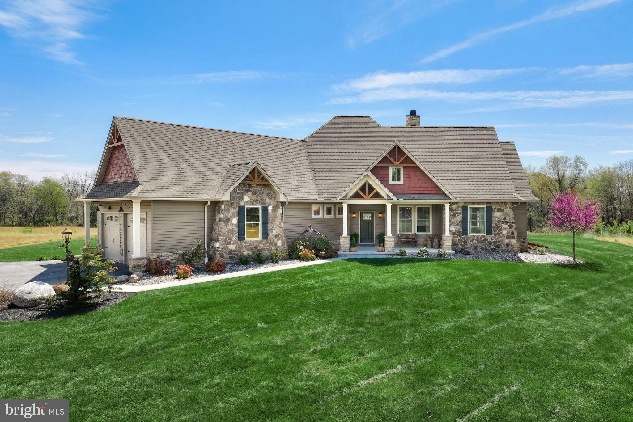 305 Gun Club Road New Oxford, PA 17350 - Photo 3 of 56 Charming home with lush green lawn.