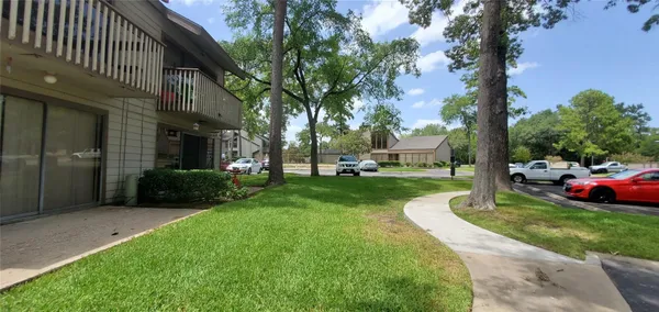 a view of outdoor space with green field and trees all around