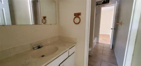 a bathroom with a tub and a sink