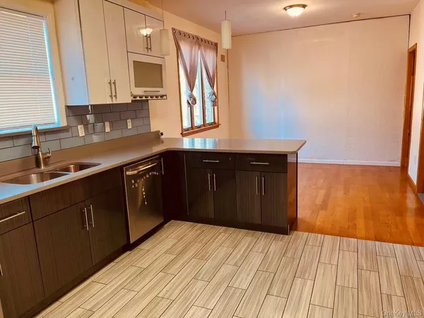 a kitchen with stainless steel appliances granite countertop a sink and cabinets