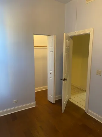 a view of a livingroom with an empty space and a window