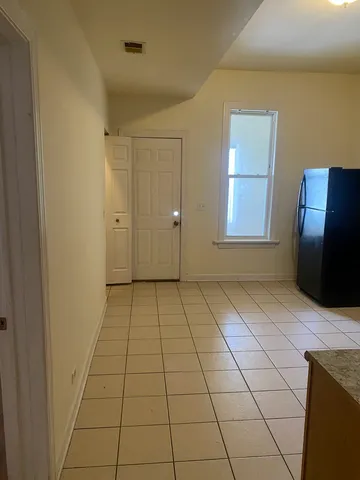 a view of a livingroom with wooden floor and furniture