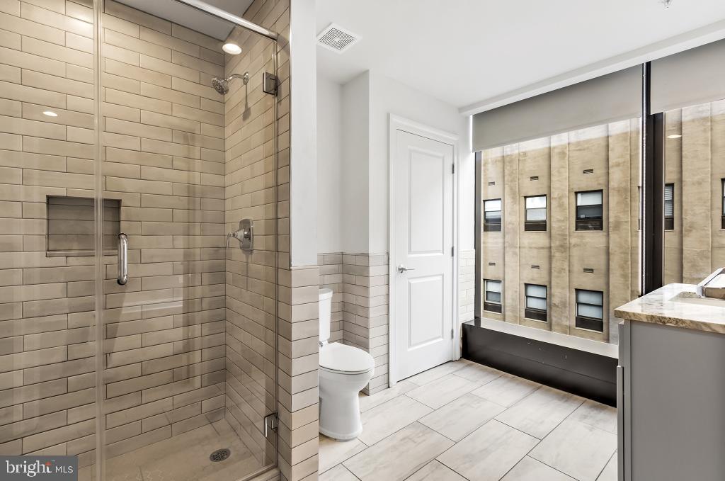 30 North 23rd Street, Unit 704 Philadelphia, PA 19103 - Photo 24 of 42 a bathroom with a shower and a toilet