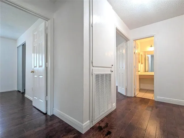 a view of a room with wooden floor