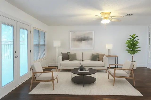 a living room with furniture and a lamp