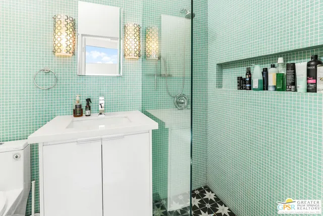 a bedroom with two beds and a dresser