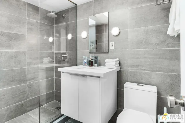 a view of a patio with a table chairs and a potted plant
