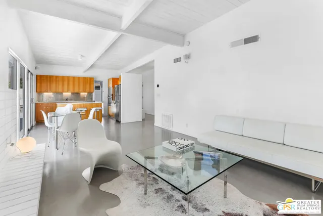 a living room with furniture and a table