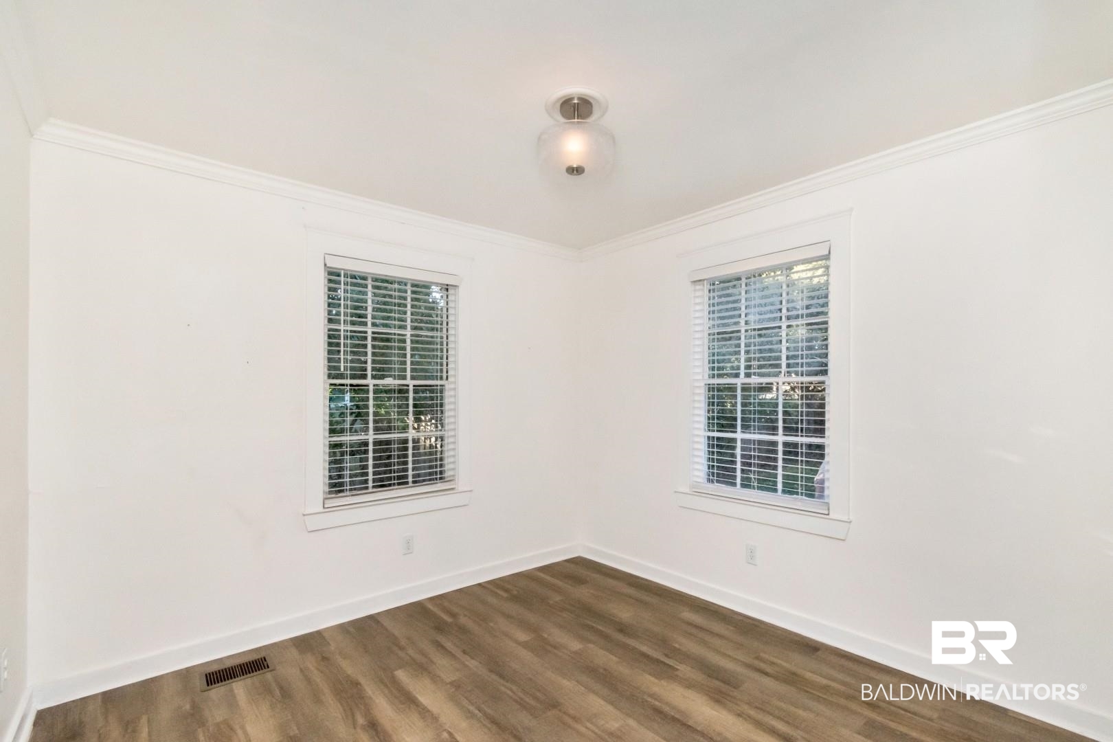 16 Princess Anne Road Mobile, AL 36608 - Photo 24 of 40 Unfurnished room with crown molding and dark wood-style floors