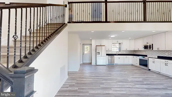 a kitchen with a refrigerator and cabinets