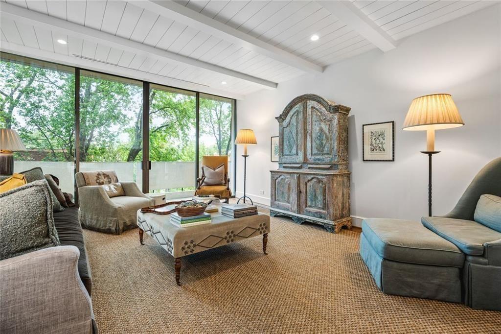 2575 Peachtree Road, Unit 8D Atlanta, GA 30305 - Photo 2 of 14 a living room with furniture and a large window