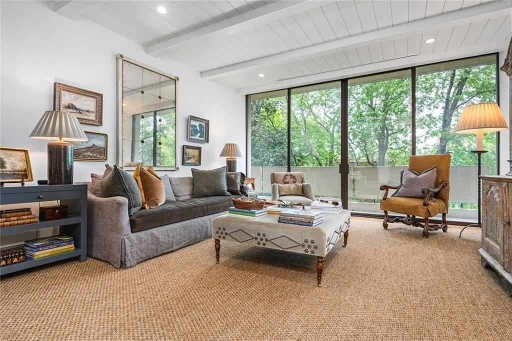 2575 Peachtree Road, Unit 8D Atlanta, GA 30305 - Photo 3 of 14 a living room with furniture and a large window