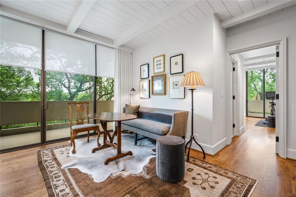 2575 Peachtree Road, Unit 8D Atlanta, GA 30305 - Photo 5 of 14 a living room with furniture a lamp and a table