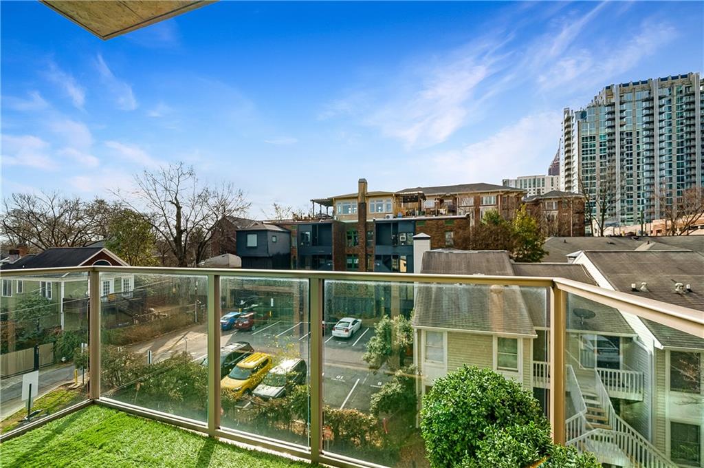 905 Juniper Street Northeast, Unit 405 Atlanta, GA 30309 - Photo 25 of 34 a view of swimming pool with outdoor seating and city view